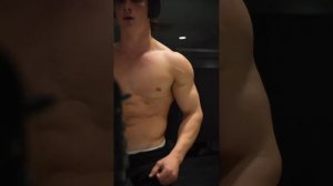 18 years old teen boy flexing muscle
