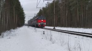 тепловоз 2ТЭ116-1545 с платформами на перегоне Ржевка - Заневский пост 1