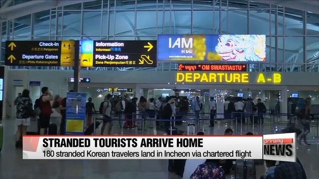 First Korean chartered flight brings home 180 Koreans stranded by Bali eruption