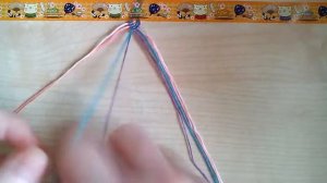 Фенечка павлинка из мулине.