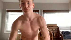 Young boy flexing muscles