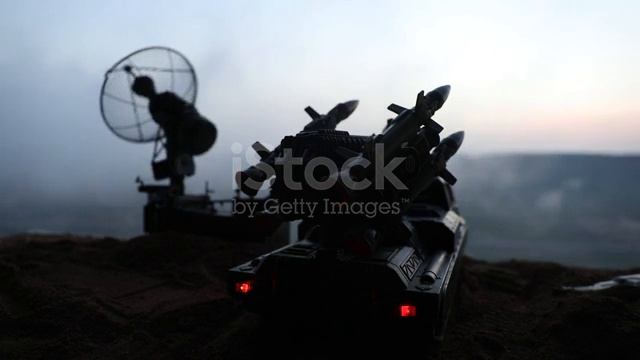 Silhouette of mobile air defence truck with radar antenna during sunset смотреть онлайн