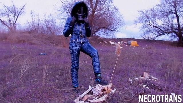 Transhumanist symbolism. Walking creatures in suit symbolizing a spacesuit. Ski overalls + gas mask