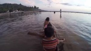 Local Children with Their Traditional Wooden Canoe