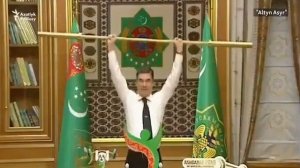 President of Turkmenistan lifts golden weights bar before his applauding Cabinet