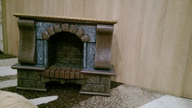 Камин из картона. Имитация деревянных колон. Фальш камин.A fireplace with a grate made of cardboard