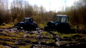 МТЗ с лебедкой вытаскивает МТЗ 82 с плугом.