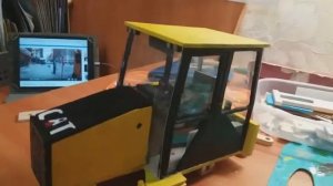 Сборка American трактора CAT 434е