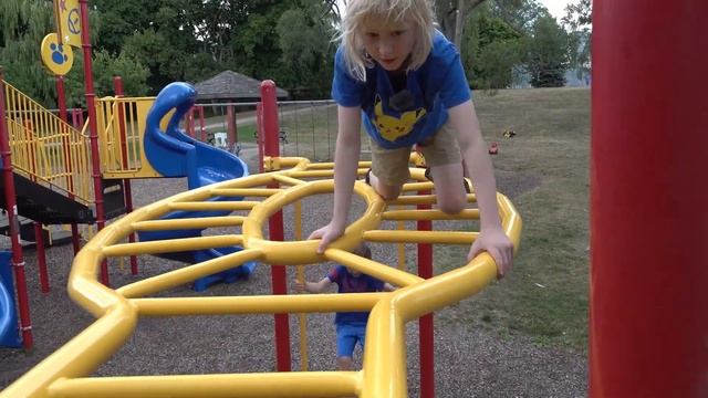 Monkey bars climbing, swinging, strength, and balance skills by 9 & 7-year-olds Jungle Gym acrobats