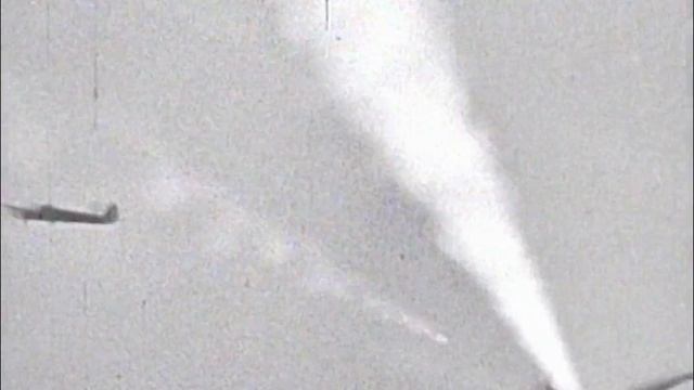 JG53 Bf109F attacking Spitfire Mk Vb which itself is stalking a Ju88 near Malta coast in early 1942