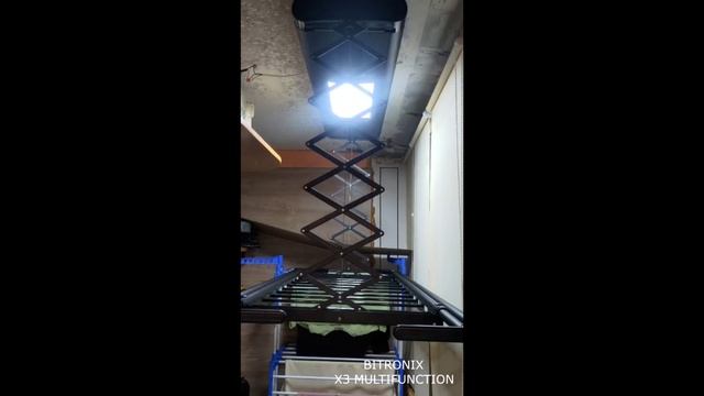 Умная потолочная сушилка Bitronix x3 multifunction в черном цвете на балконе