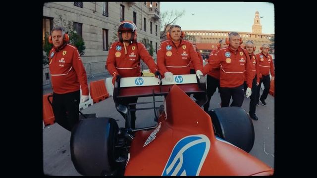 Lewis and Charles driving TOGETHER on the streets of Milan