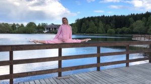 Ballerina walking in pointe shoes in the park. Funny stretching.