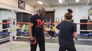 Floyd Mayweather Sr. working with amateur visiting the Mayweather Boxing Club