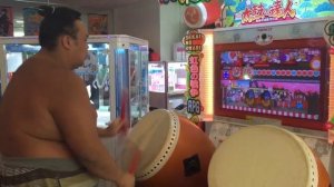 Sumo Wrestler Expertly Plays Drumming Video Game (Storyful, Funny)