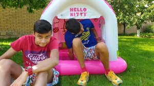 Alena and Pasha play with Magic playhouse