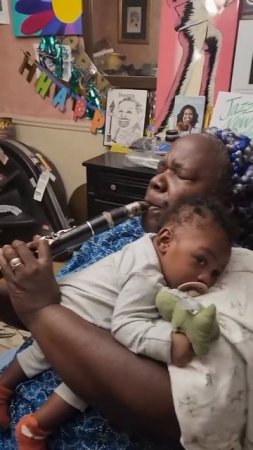 Clarinetist Doreen Ketchens playing for her grandson