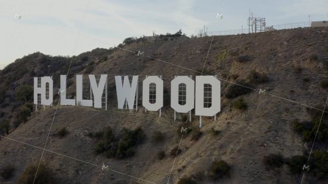 AERIAL: Close Up of Hollywood Sign Letters at Sunset, Los Angeles, California