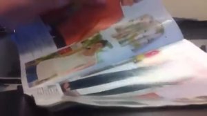 Whispering in English and Russian and flipping through a magazine First video