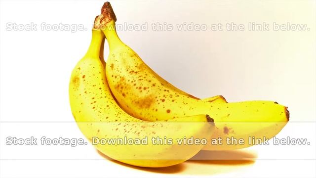 Looped: bunch of ripe tasty yellow bananas spinned