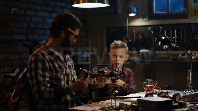 Father And Son Repair Drone Stock Video смотреть онлайн