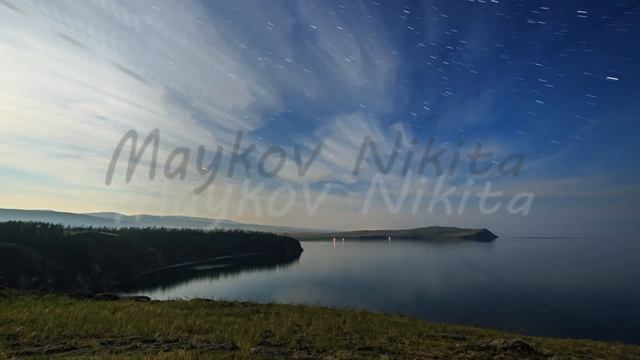 Russia, Lake Baikal, Olkhon Island, Clouds and stars on a moonlit night over Small Sea Bay. Short t смотреть онлайн