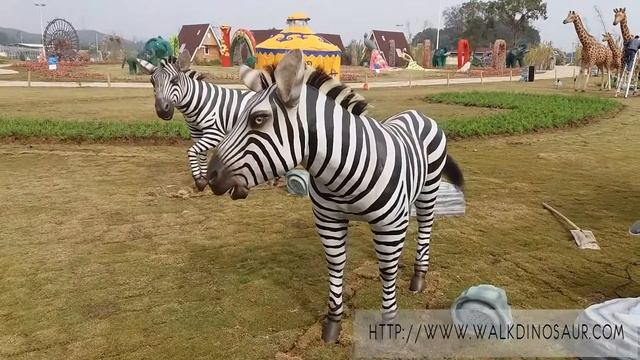 Zebra model a pair in amusement park with people смотреть онлайн
