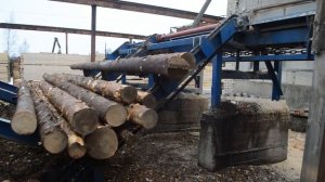 Разобщитель бревен и поперечный транспортер Аркон