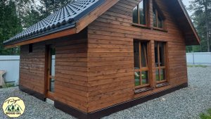 Покрытие фасада бани цветным маслом