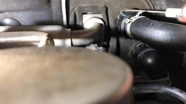 2013 Chevy Sonic 1.8L heater hose removal.