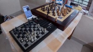 Square off chess set ( AI level 10) vs Kasparov chess computer (level A4)