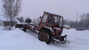 Т16 чистит снег