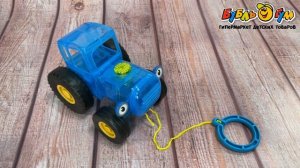 Каталка на веревке УМка Синий трактор световые эффекты 7песен 3загадки