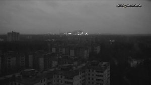 Вечерний вид с шестнадцатиэтажки на Припять и ЧАЭС