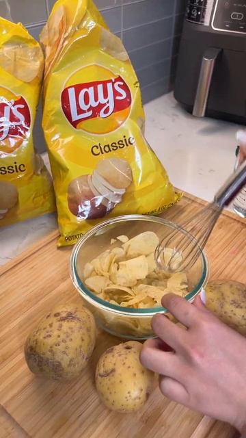 Woman make new dish from chips  Shorts