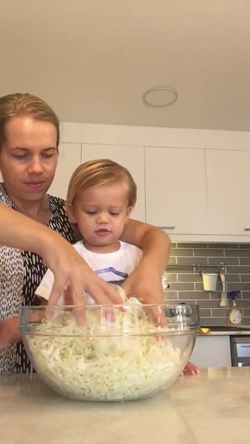 Toddler helping make polish sauerkraut