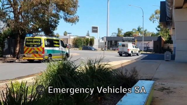 SA Police Holden Colorado and SAAS Mercedes-Benz ambulance departing with lights and sirens
