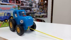 Синий трактор -музыкальная каталка на верёвочке. Умка