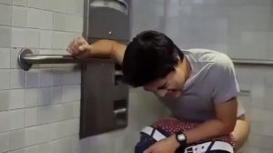 Man taking a shit on a dirty  toilet