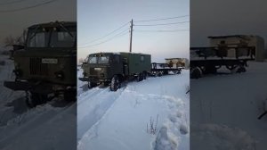 Газ 66 с тракторной телегой по снегу