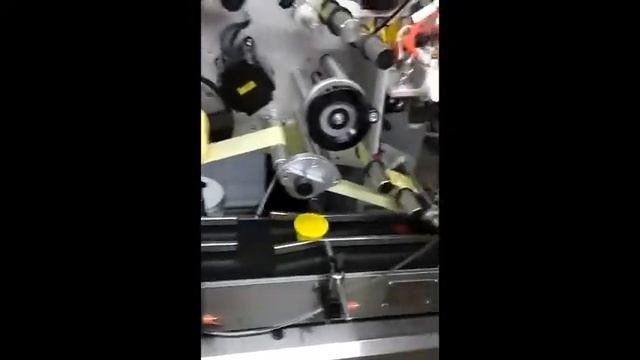 Этикетировочный автомат на крышку тары / Labeling machine for container lids