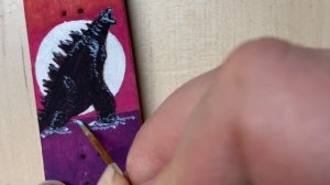 Painting Godzilla on a Fingerboard for my Partner