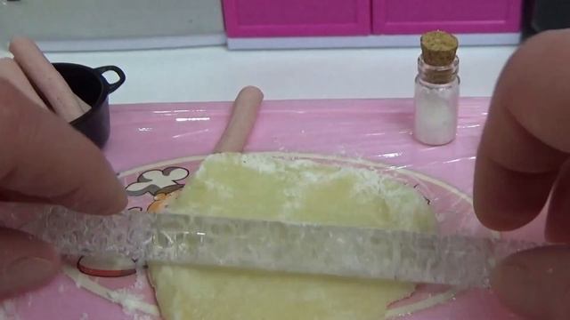 Real food miniature sausages in dough in a mini oven mini kitchen ASMR