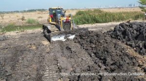 Heavy Shantui Bulldozer Working And Dongfeng Dump Trucks Unloading Dirt Mud Land Filling Up In Wate