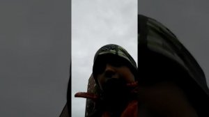 Катаюсь с братом по лужам.