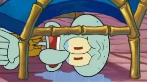 Сквидвард плачет под стулом, и это очень печально