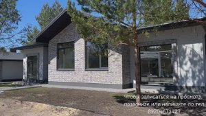Дом с гаражом и банным комплексом в окружении сосен