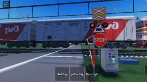 2ТЭ121 с грузовым поездом проезжает железнодорожный переезд