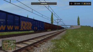Тепловоз ТЭМ7-0202 с грузовым поездом проезжает неизвестную станцию в Farming Simulator 17