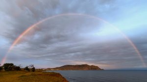 Радуга над морем и мысом Меганом. Город Судак. Крым. Май 2025